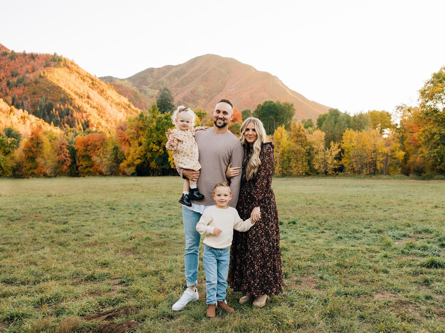 family standing outdoors in a yard representing safe, pest-free home protection