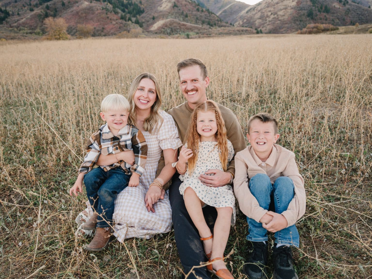 family sitting together outdoors representing a safe, pest-free home environment